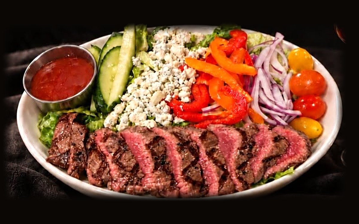 Sirloin Salad with sliced grilled sirloin over romaine